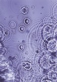 Color photograph of ripples of water on a lilac background