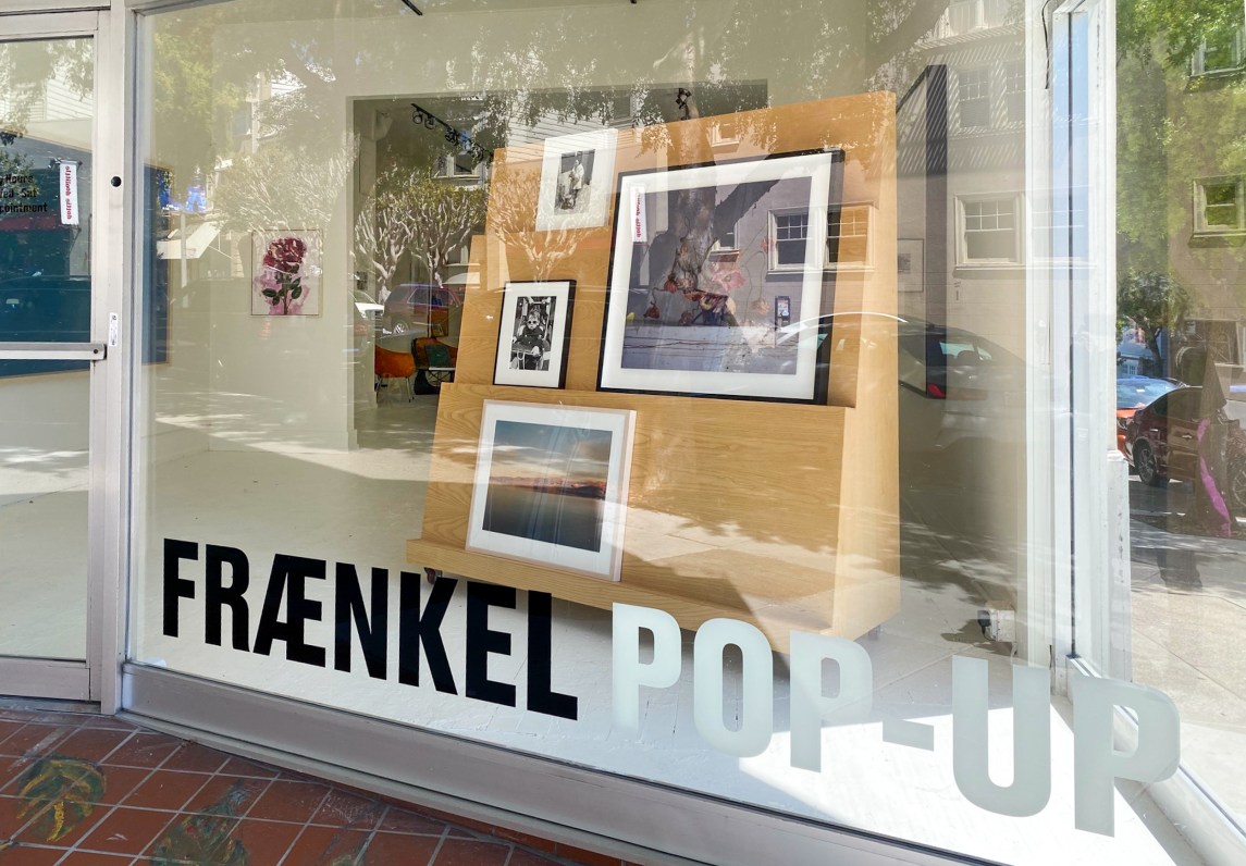 Colorful image of a building with large windows displaying artwork on view and a sign that reads Fraenkel Pop-up