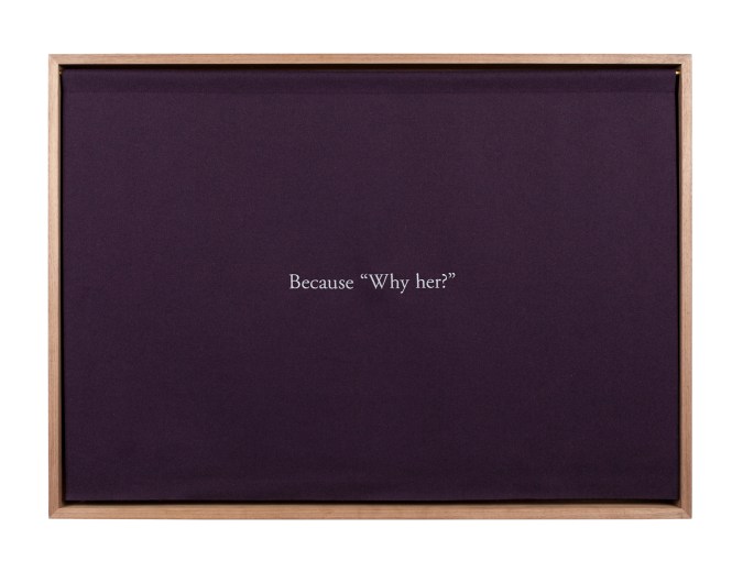 A wooden box, with a purple curtain embroidered with white text, "Because 'Why her?'"
