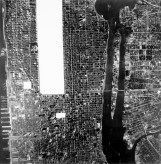 Black and white aerial photograph of a portion of midtown Manhattan and Central Park