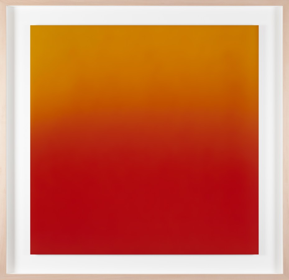 Color photograph of a yellow and red gradient framed in a light pine
